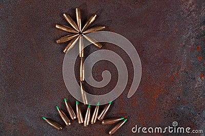 War and Peace, flowerand grass from bullets. Stock Photo