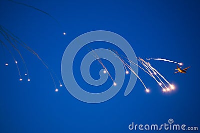 War plane dropping flares Stock Photo