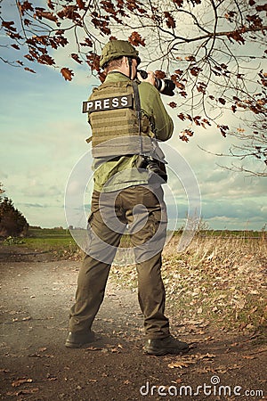 War press photographer taking pictures Stock Photo