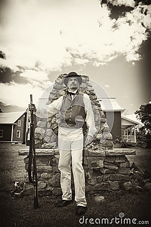 War of 1812 or Rev War Reenactor Standing with Mus Stock Photo