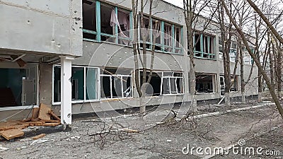 War in Ukraine. Destroyed school after shelling in Mariupol Stock Photo