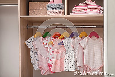 Wardrobe with cute baby clothes Stock Photo