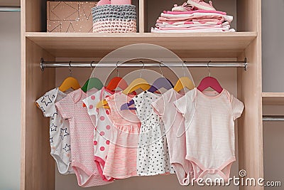 Wardrobe with cute baby clothes Stock Photo