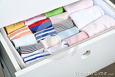 Wardrobe drawer with many child socks Stock Photo