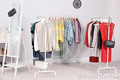 Wardrobe racks with different stylish clothes Stock Photo