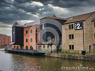 Warehouse buildings at Wigan Pier on the Leeds - Liverpool Canal. Editorial Stock Photo