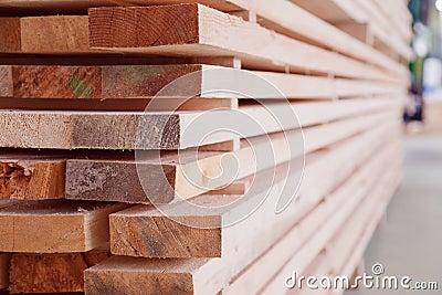 Warehouse or factory for sawing boards on sawmill indoors. Wood timber stack of wooden blanks construction material Stock Photo