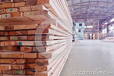 Warehouse or factory for sawing boards on sawmill indoors. Wood timber stack of wooden blanks construction material Stock Photo