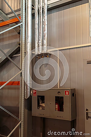 Warehouse fire extinguishing system. fire hydrants with sleeves in boxes Stock Photo