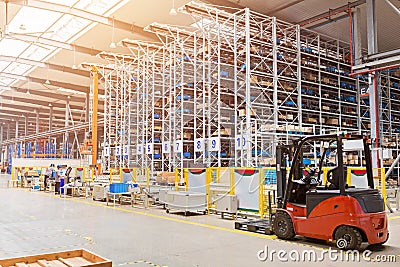 The warehouse full of goods, boxes and shelves. Industrial background container plant manufacturing manufacture production Stock Photo