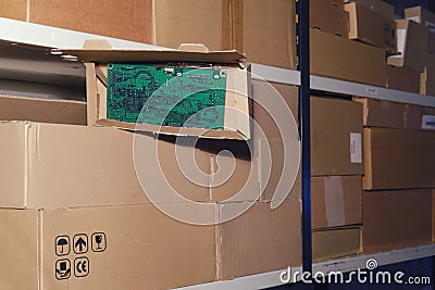 Warehouse with opened boxes with computer equipment. Theft of electronics parts in a mail warehouse during quarantine due to Stock Photo