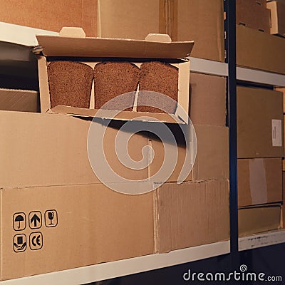 Warehouse with opened boxes of food. Theft of bread in a mail warehouse during quarantine due to coronavirus Stock Photo