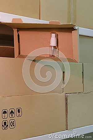 Warehouse with opened boxes with sanitizer. Theft of soap in a mail warehouse during quarantine due to coronavirus Stock Photo