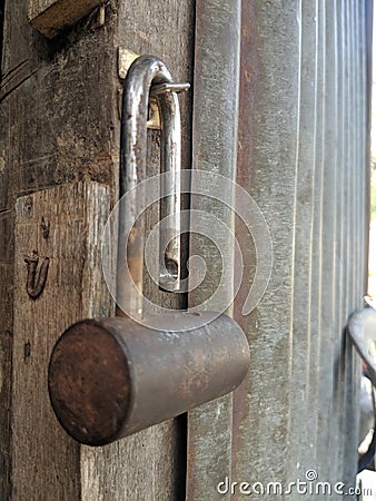 warehouse padlocks that corrode because of the tropical climate Stock Photo