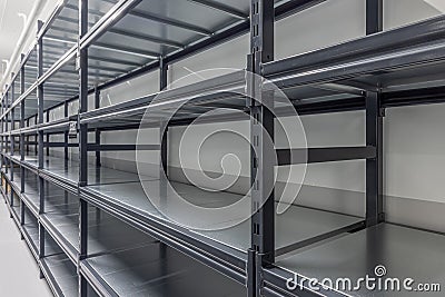 Warehouse racks storage metal pallet racking system in warehouse. Modern interior of new empty warehouse. The shelves are pallet Stock Photo