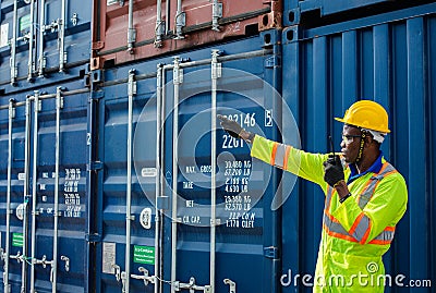 Warehouse shipping transportation concept. Commercial docks worker and inspector at commercial dock. Workers are wearing Stock Photo