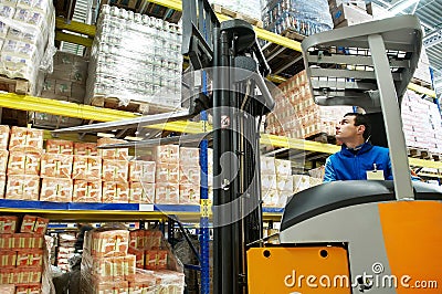 Warehouse stacker loader worker Stock Photo