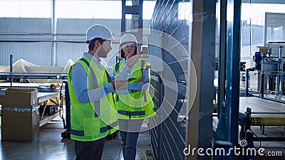 Warehouse supervisors inspection process checking factory equipment analysing Stock Photo