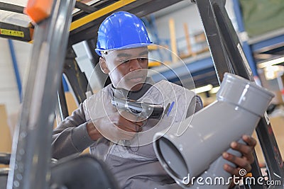 Warehouseman with protective vest and scanner Stock Photo