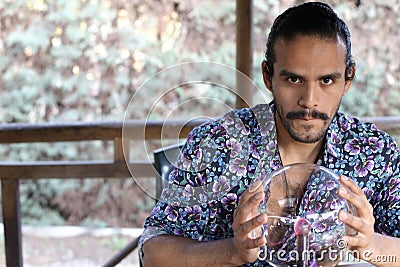 Warlock using crystal ball to read fortune Stock Photo