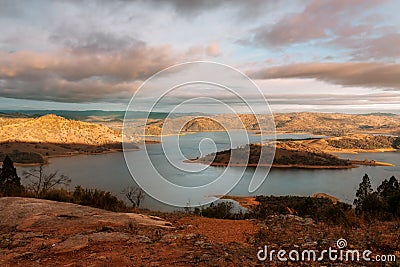 Sunlight across the hills and lake in country NSW Australia Stock Photo