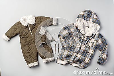 Warm baby coat for boys on gray background top view Stock Photo