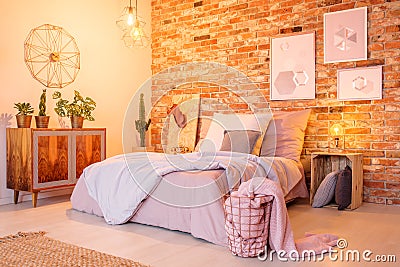 Warm bedroom with brick wall Stock Photo