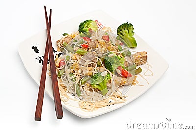 Warm Chinese salad with rice noodles Stock Photo