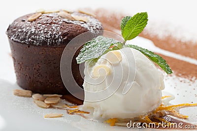 Warm chocolate cake Fondant with ice-cream ball, almond, mint, c Stock Photo