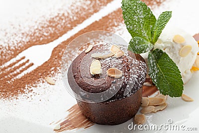 Warm chocolate cake Fondant with ice-cream ball, almond, mint, c Stock Photo