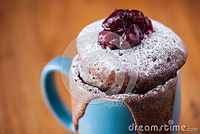 Warm chocolate cake in a mug sprinkled with icing sugar Stock Photo