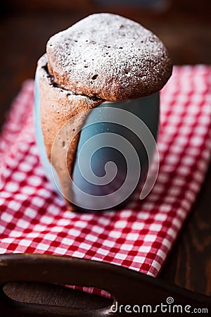 Warm chocolate cake in a mug sprinkled with icing sugar Stock Photo