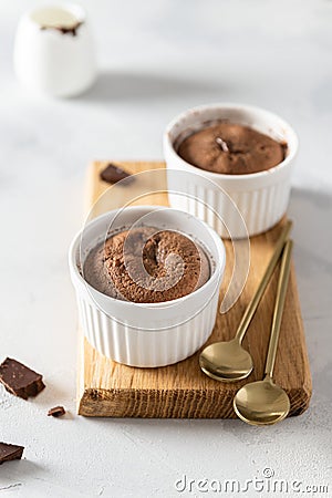Warm Chocolate Lava Cake in ramenkins on white background. Restaurant, bakery, confectionery menu, recipe Stock Photo