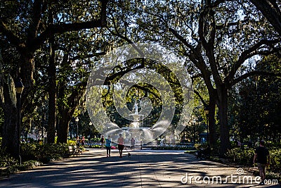 A Warm day at Forsyth Park in Savannah, Georgia Shaded by Magnolia Trees Editorial Stock Photo