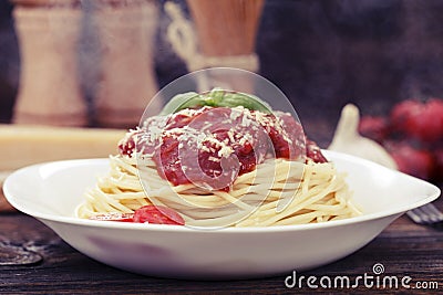 Warm, delicious spaghetti with sauce and basil. Stock Photo