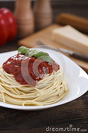 Warm, delicious spaghetti with sauce and basil. Stock Photo
