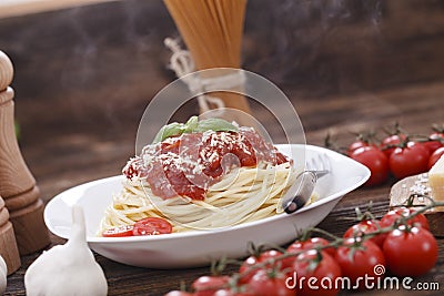 Warm, delicious spaghetti with sauce and basil. Stock Photo