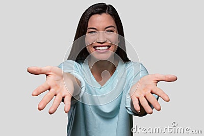 Warm and friendly woman reaching her arms and hands out, welcoming an embrace, giving, receiving, welcoming, child`s POV perspecti Stock Photo