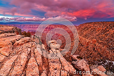 Warm light illuminates the Grand Canyon at sunset Stock Photo