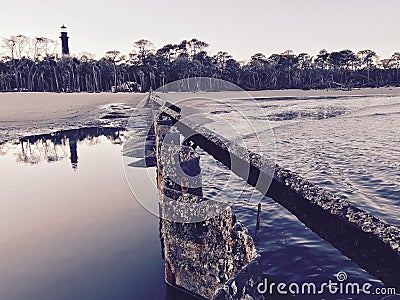A warm look at a light house in snowy South Carolina - Hunting Island - USA Stock Photo