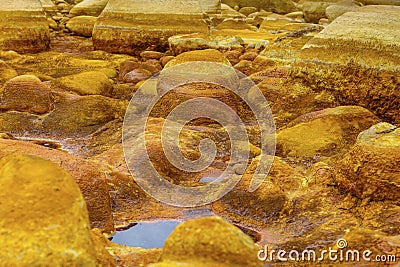 Orange Mineral Formations and Puddles at Rio Tinto Stock Photo