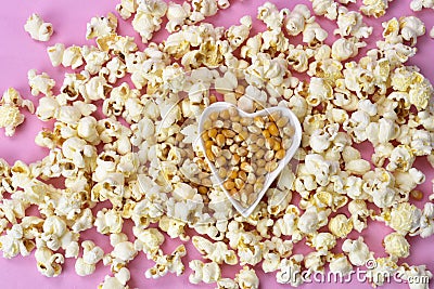 Warm popcorn viewed from above on pink background. Top view. Enterteinment concept Stock Photo