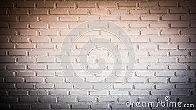 Warm red Spotlight on brick wall with dark corner Stock Photo