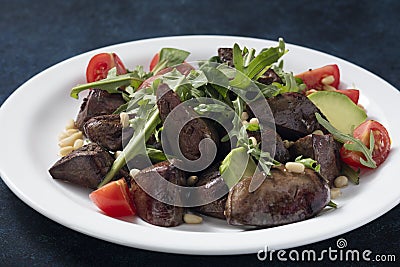 Warm salad from turkey liver Stock Photo