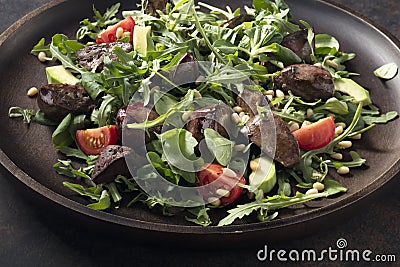 Warm salad from turkey liver Stock Photo