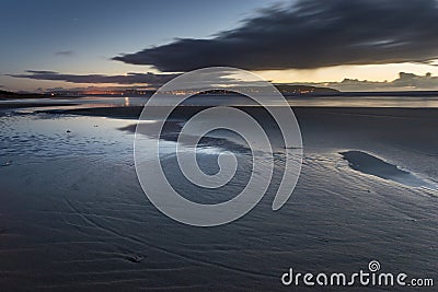 Warm sundown over sand beach Stock Photo