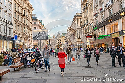 Warm sunset over busy with tourists famous Graben shopping street near Stephans square Stephansplatz in historical touristic Editorial Stock Photo