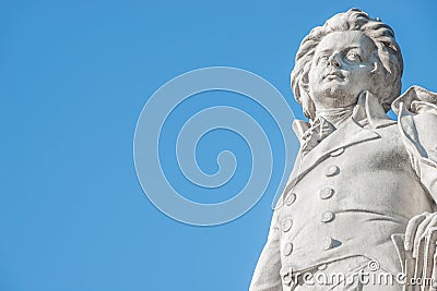 Warm sunset over Mozart monument in front of Palmenhaus, near Neue Burg and Hofburg Palaces garden, in historical downtown of Editorial Stock Photo