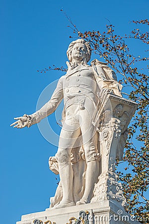 Warm sunset over Mozart monument in front of Palmenhaus, near Neue Burg and Hofburg Palaces garden, in historical downtown of Editorial Stock Photo