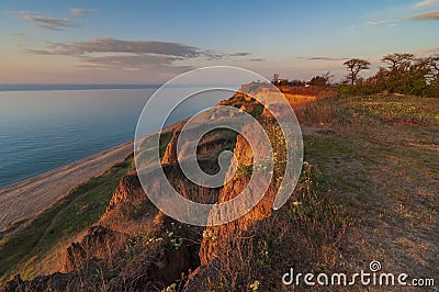 Warm sunset at the sea coast Stock Photo